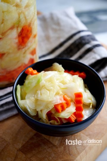 Crunchy pickled cabbage. Made with a salty, sweet, and tangy brine and a little bit of sunflower oil. Very crunchy and addictively tasty. A perfect healthy side dish to grilled, BBQed and smoked meats.