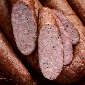 Close-up of Smoked Country Sausage cross-cut. Beautiful texture.