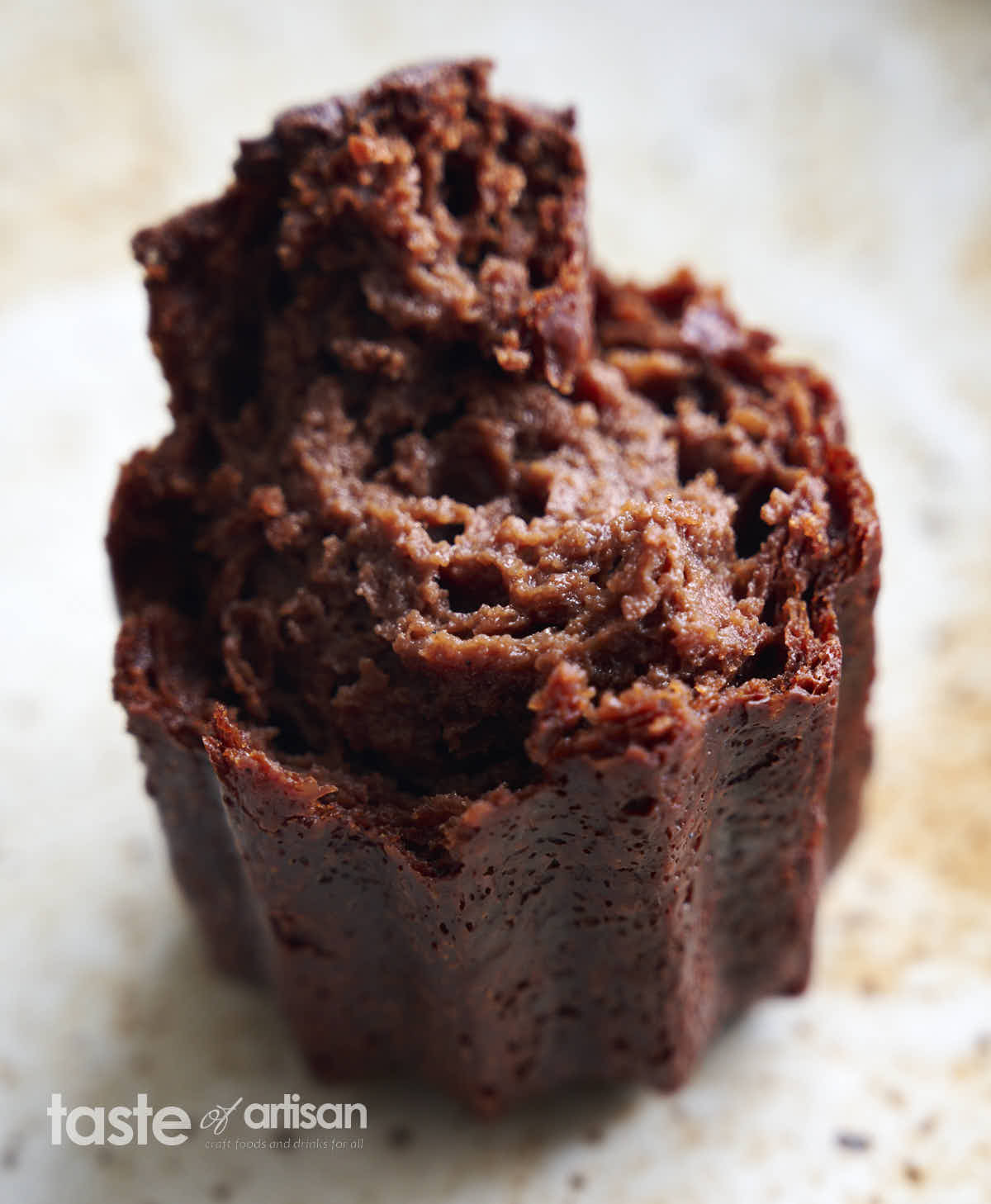 Creamy crumb of chocolate canele - an exquisite Bordeaux pastry.