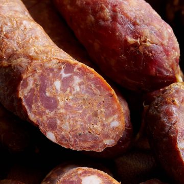 Sremska Smoked Sausage - a spicy sausage with a great burst of flavor. It makes a perfect snack, accompaniment to your charcuterie platter, or a meal.