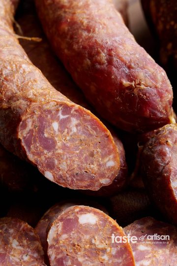 Sremska Smoked Sausage - a spicy sausage with a great burst of flavor. It makes a perfect snack, accompaniment to your charcuterie platter, or a meal.