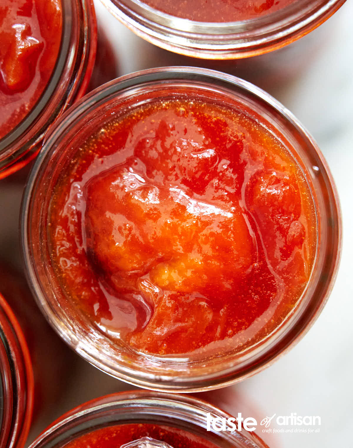 Chunky homemade apricot jam in a jar.