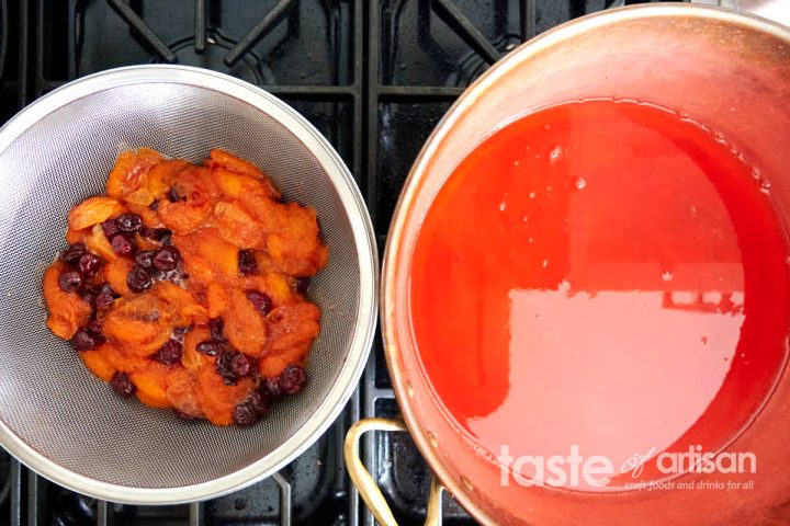 Cooked apricots in a colander.