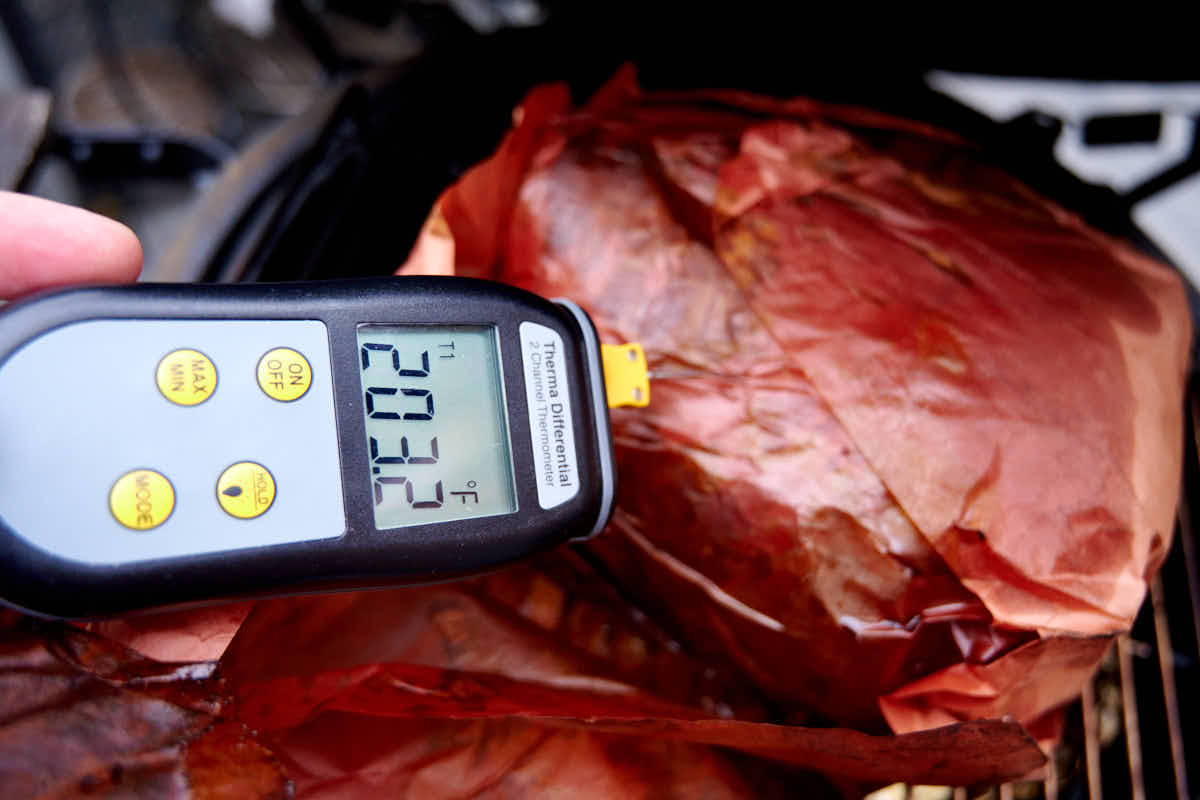 Checking smoked chuck meat temperature