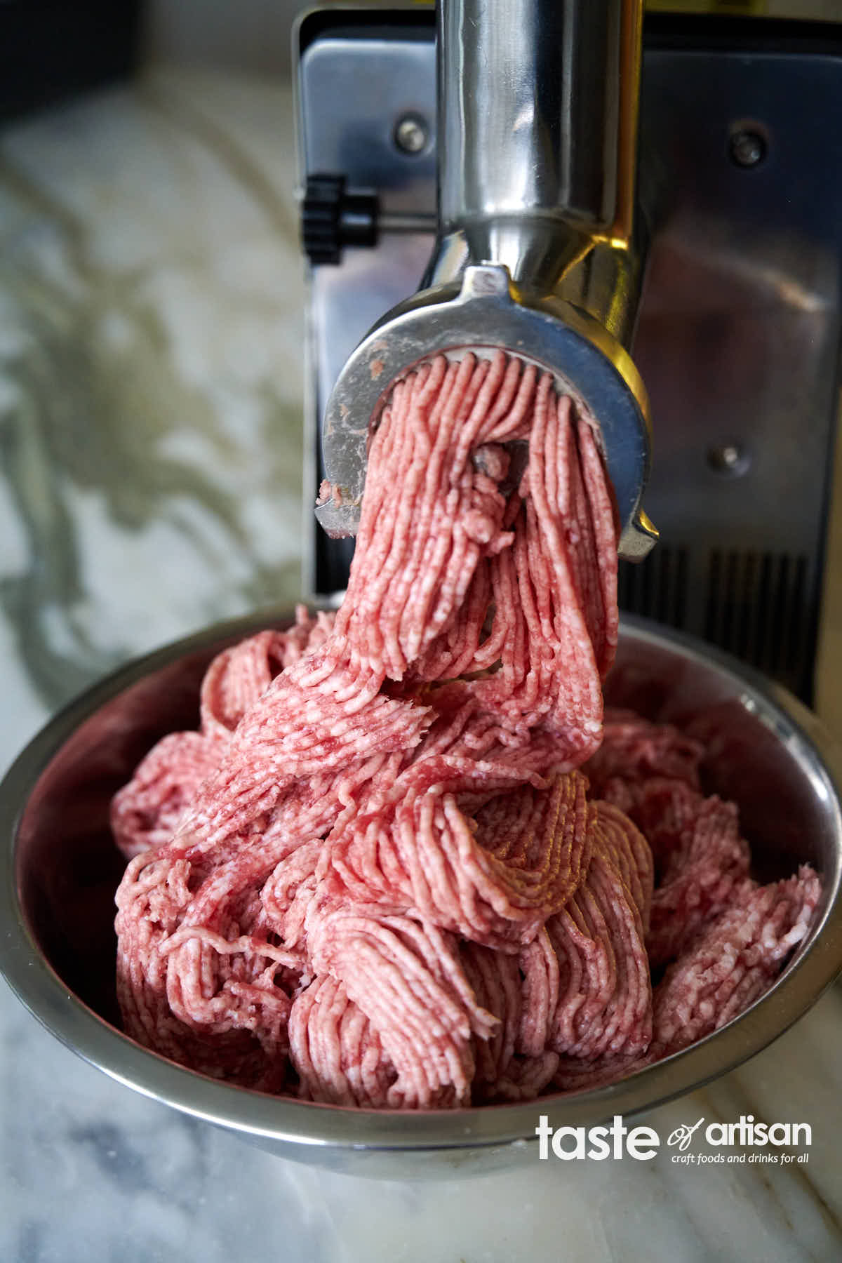 Grinding meat for maple sausage