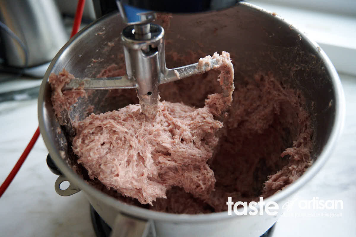 Mixing meat mixture for sausage