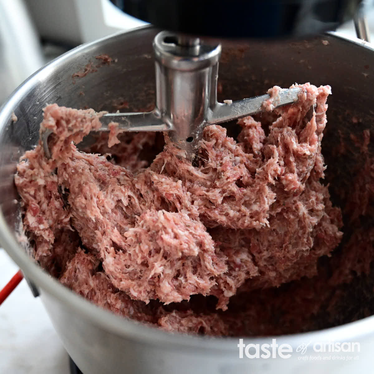 Mixing pork for country sausage