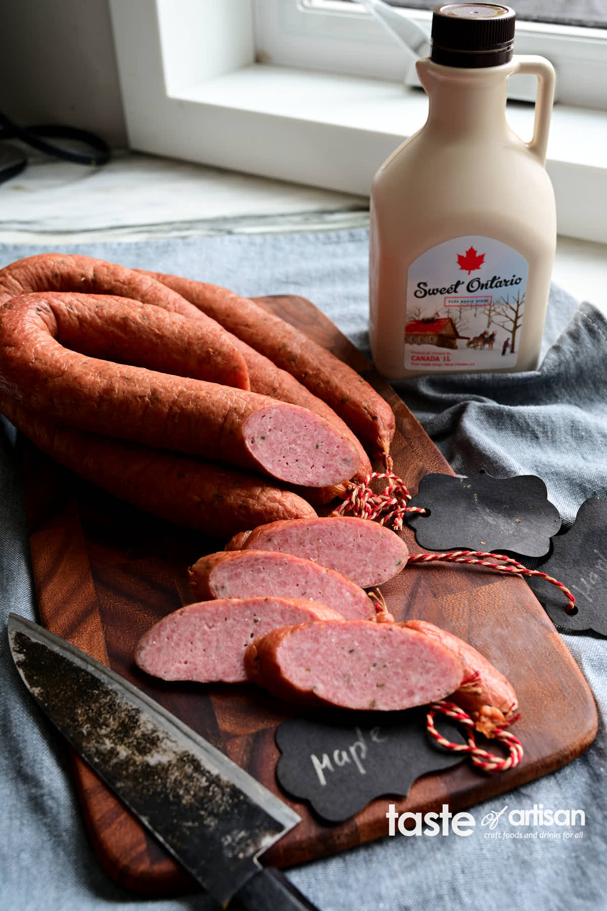 This smoked maple sausage is a definite crowd-pleaser. Its mild flavor profile, with notes of herbs and spices, is very pleasing. The maple flavor is easily identifiable; it hits you with the first bite, but it's not overpowering. The taste of this sausage is a mix of sweet and savory, with sweetness quite subtle, leaving you with a pleasant aftertaste. The texture is smooth but not mortadella smooth. This is a fantastic sausage when you crave an interesting character and subtle sweetness.