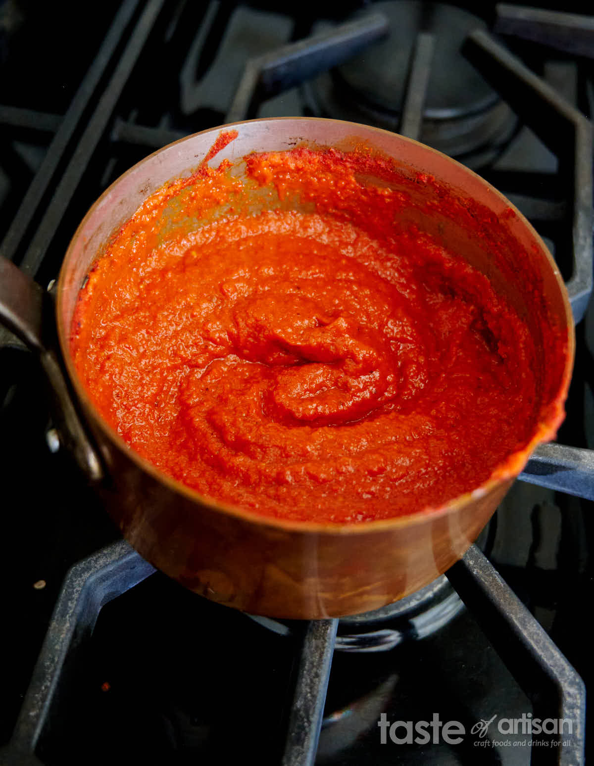 Cooking pepper sauce in a saucepan.