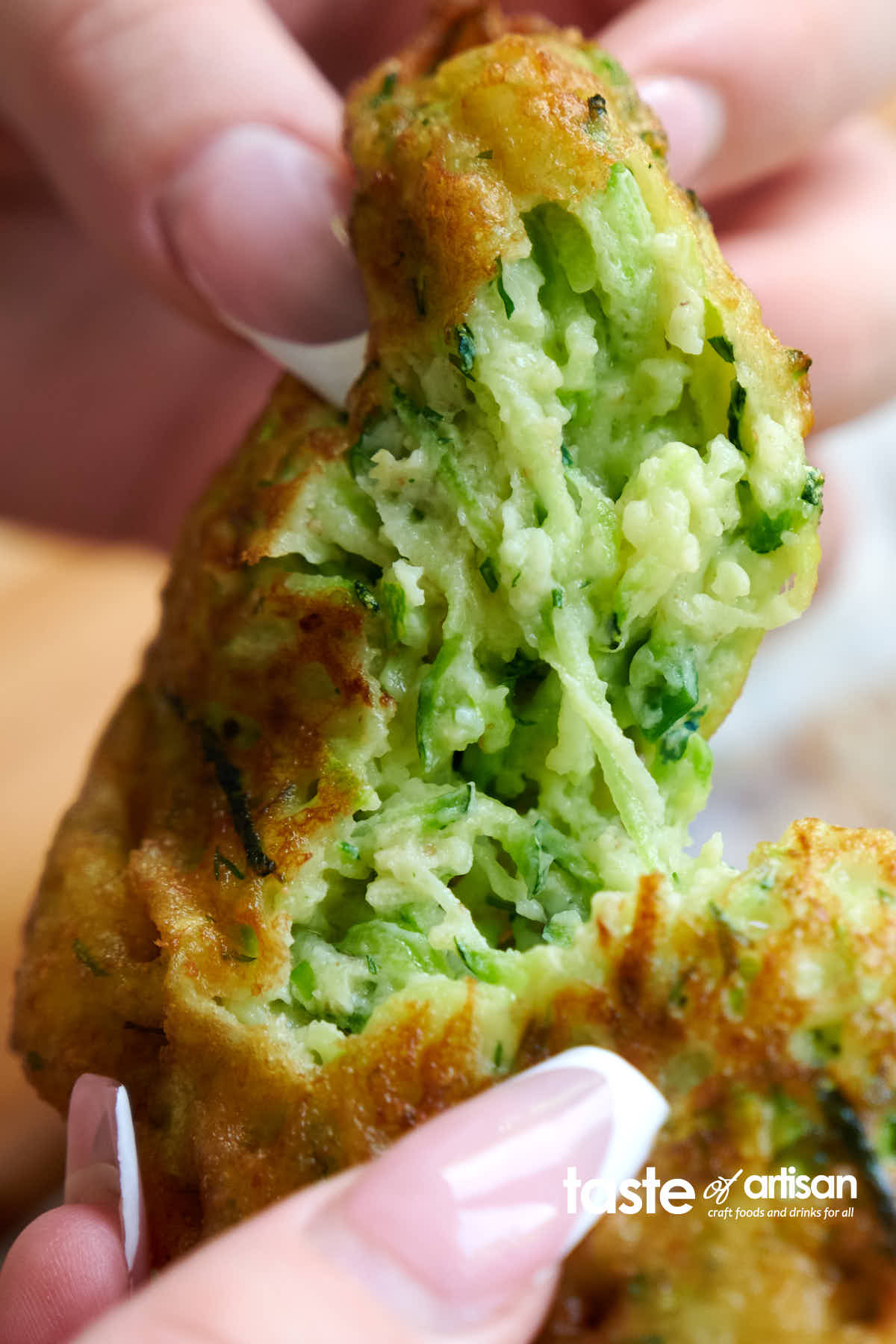 Sourdough discard zucchini pancakes with a soft, creamy interior and a crispy exterior.