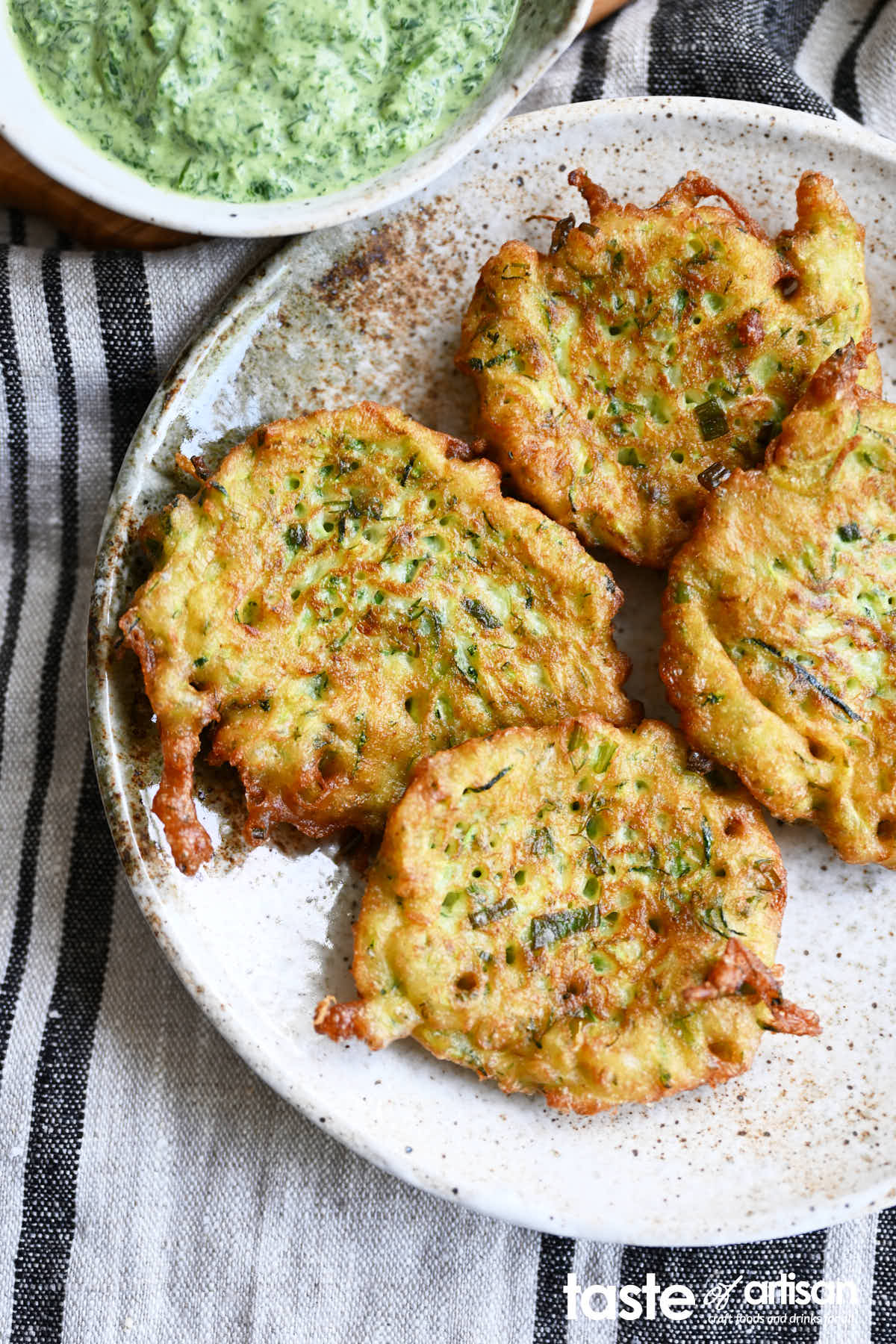 Zucchini pancakes that utilize sourdough starter discard to give them an airier texture and an improved flavor.