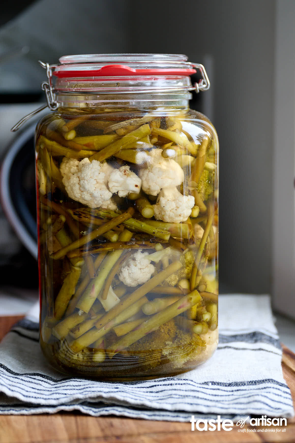 Pickled vegetables - slightly roasted over high heat to soften them up and add flavor, then placed in a glass jar and topped with a simple pickling brine. This pickled vegetables go well with roasted, grilled and BBQed meats, potatoes, and more. I like them on their own as a snack too. They are delicious.